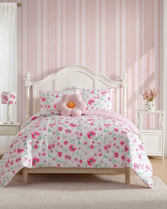 Meadow Daisies Comforter Set on a bed in a room.