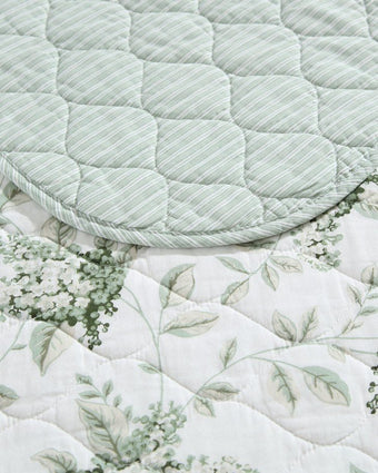 Portland Floral Green Cotton Reversible Quilt Set closeup of print and reverse