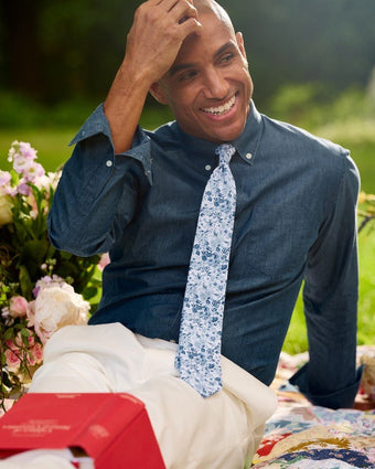 Quartet Floral White Tie view of tie on model.